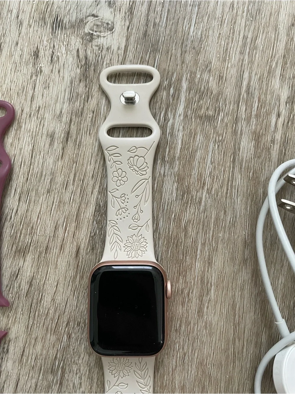 Apple Smartwatch with White, Black, and Mauve Bands